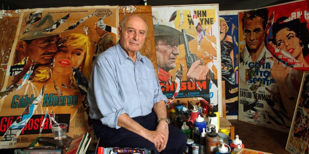 the painter mimmo rotella in his studio is seated on a news photo 1643628451 scaled e1704211727957 - Meraviglie di Calabria - 4